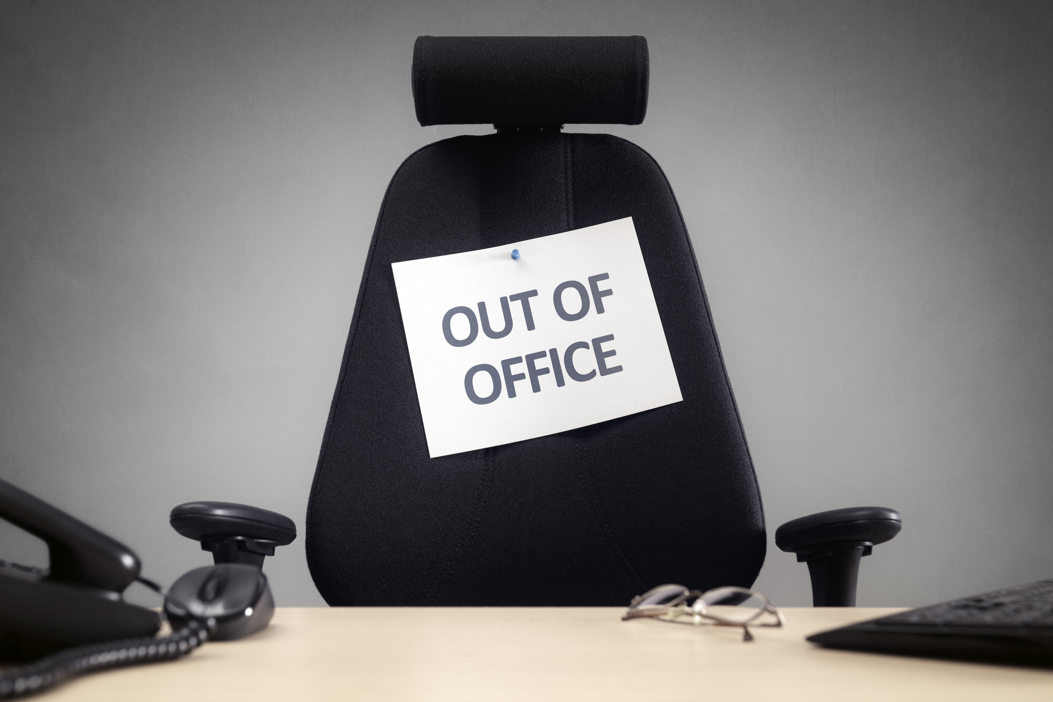 Business chair with out of office sign concept for vacation, holiday, lunch break or work life balance