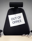 Business chair with out of office sign concept for vacation, holiday, lunch break or work life balance