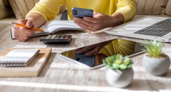 Budgeting Basics Woman Setting Financial Goals at Home, Organizing Her Finances and Controlling Daily Expenses.